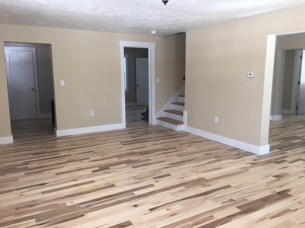 181 Westboro Road Upton, MA 01568 - Photo 9 of 15 an empty room with wooden floor and entryway
