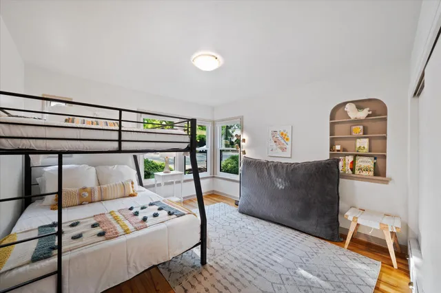 a bedroom with furniture and a window