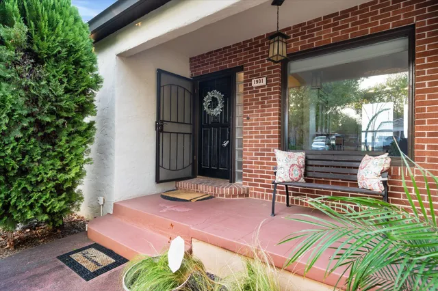 a front view of a house with garden
