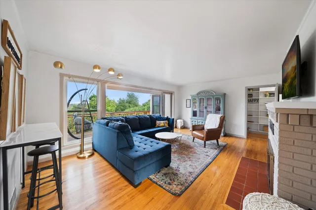 a living room with fireplace furniture and a flat screen tv
