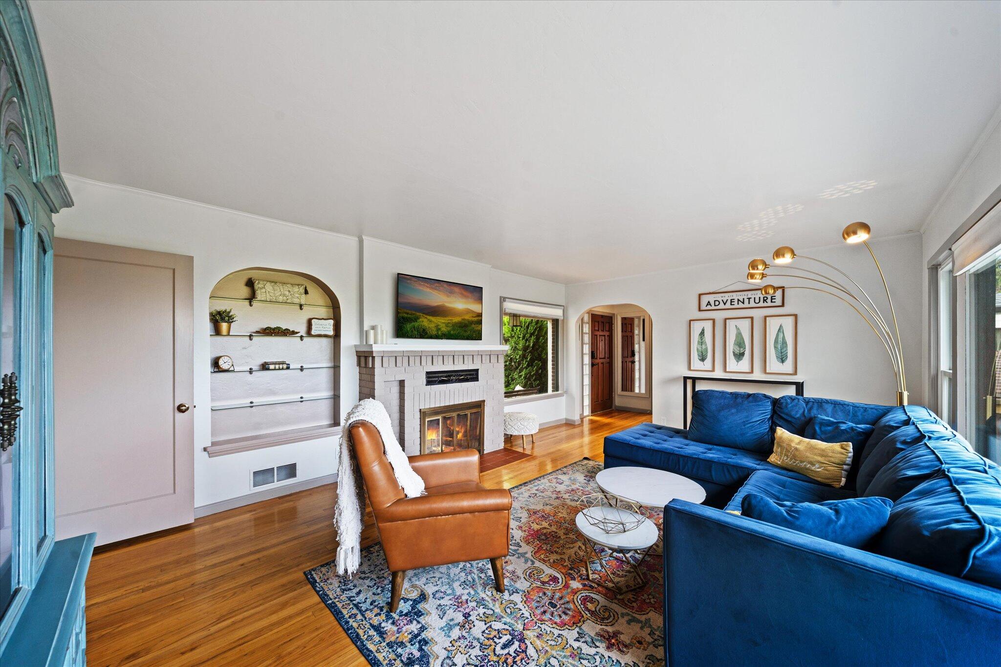 1901 Chestnut Street Redding, CA 96001 - Photo 6 of 39 a living room with furniture a rug and a bookshelf