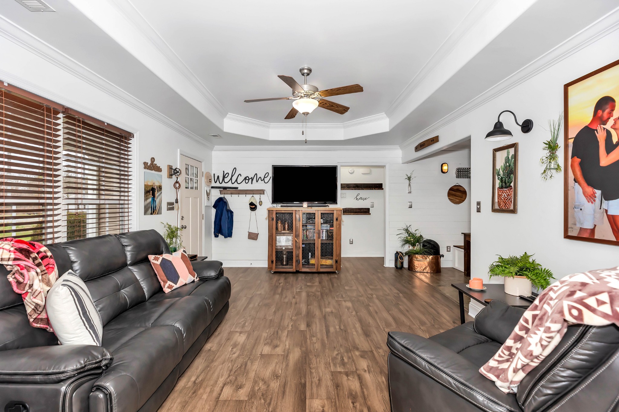 25518 Clem Road Elkmont, AL 35620 - Photo 4 of 24 a living room with furniture and a flat screen tv with wooden floor