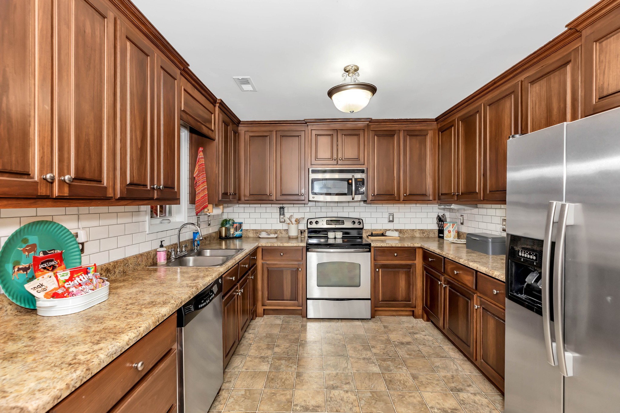 25518 Clem Road Elkmont, AL 35620 - Photo 7 of 24 a kitchen with kitchen island granite countertop a sink stainless steel appliances and cabinets