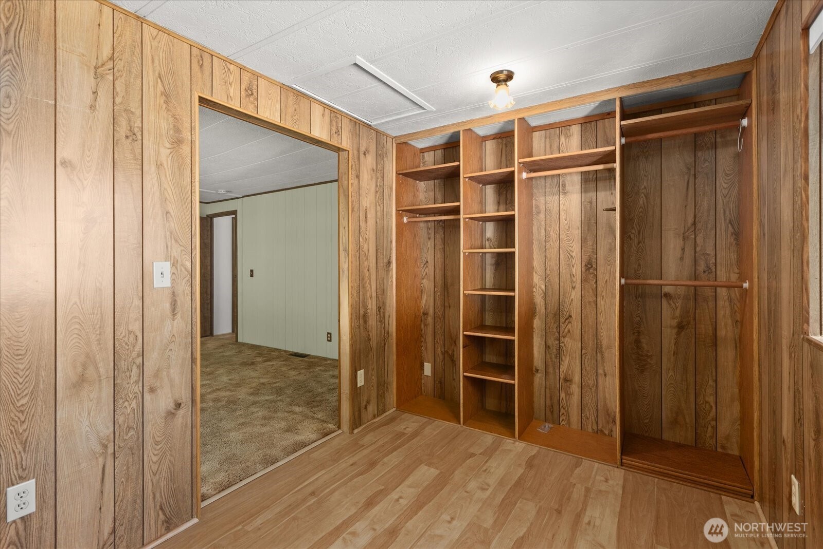 815 124th Street Southwest, Unit 133 Everett, WA 98204 - Photo 17 of 38 a view of empty room with wooden floor and closet
