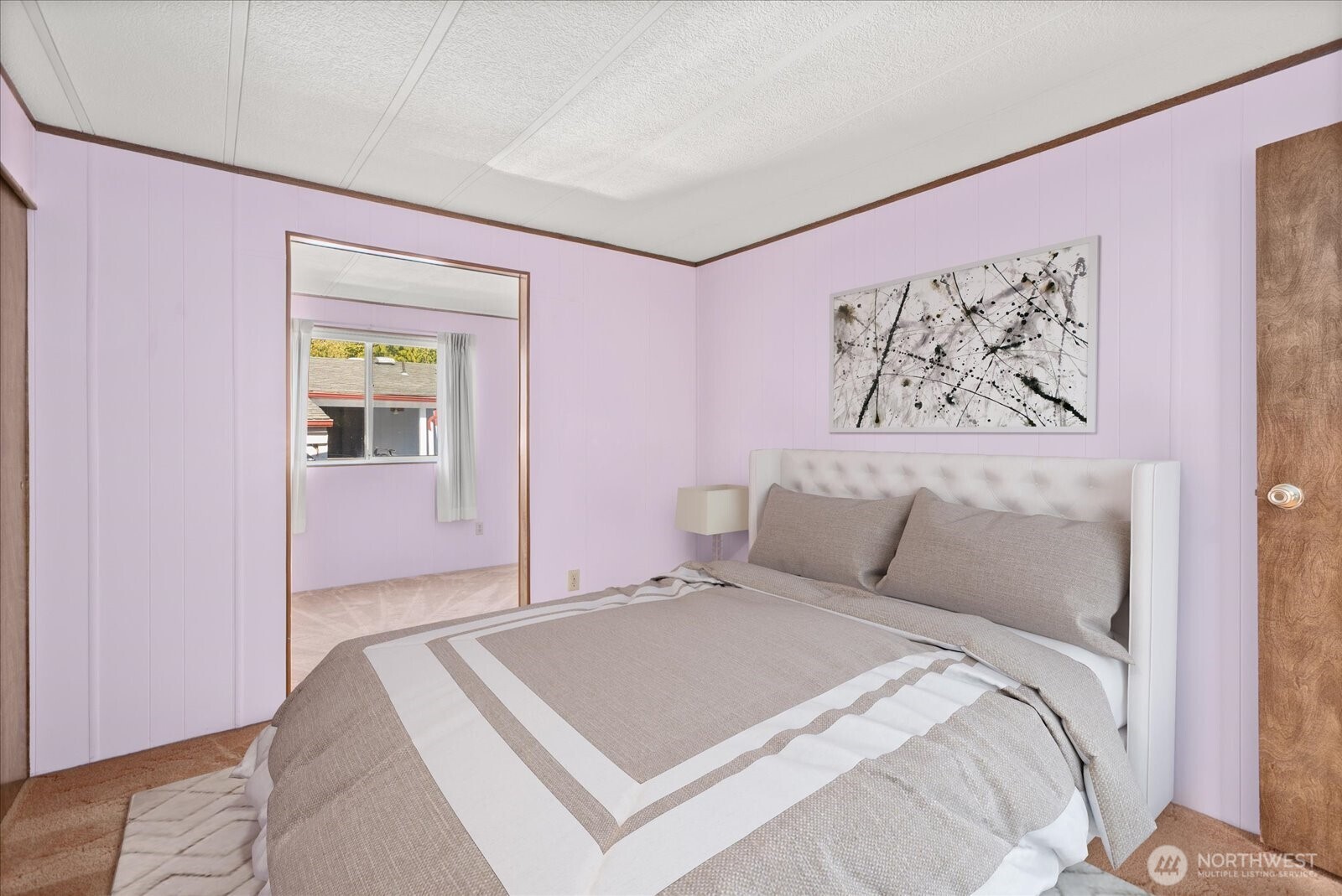 815 124th Street Southwest, Unit 133 Everett, WA 98204 - Photo 22 of 38 a bedroom with a bed and a painting on the wall