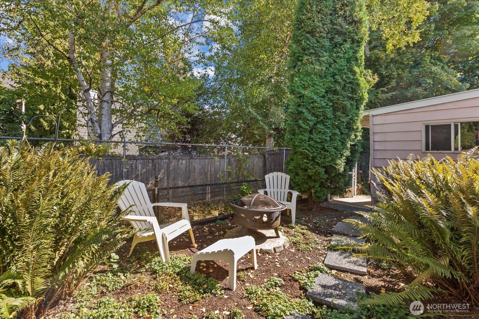 815 124th Street Southwest, Unit 133 Everett, WA 98204 - Photo 27 of 38 a view of a chairs and table in backyard