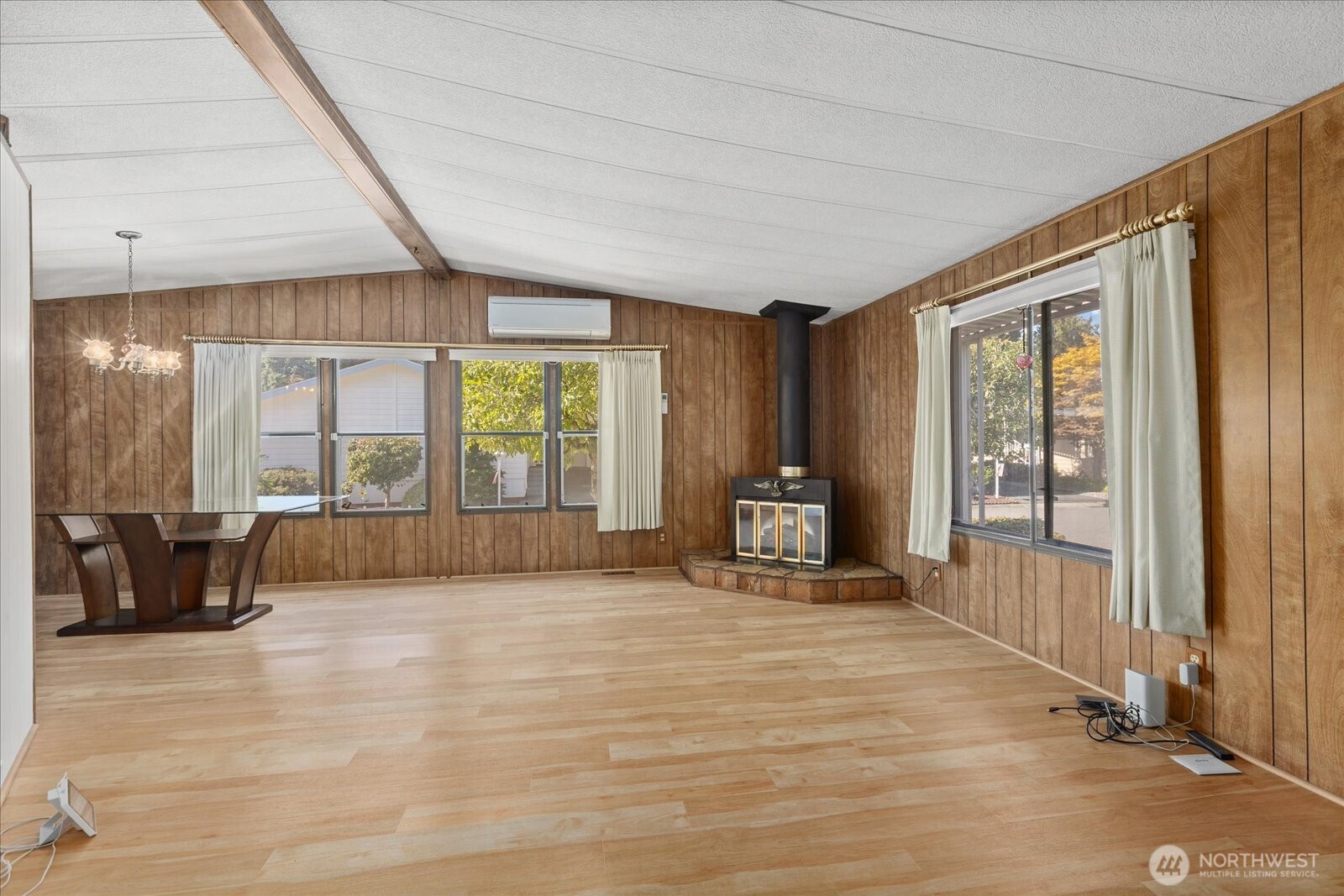 815 124th Street Southwest, Unit 133 Everett, WA 98204 - Photo 5 of 38 a spacious bedroom with a bed and large windows