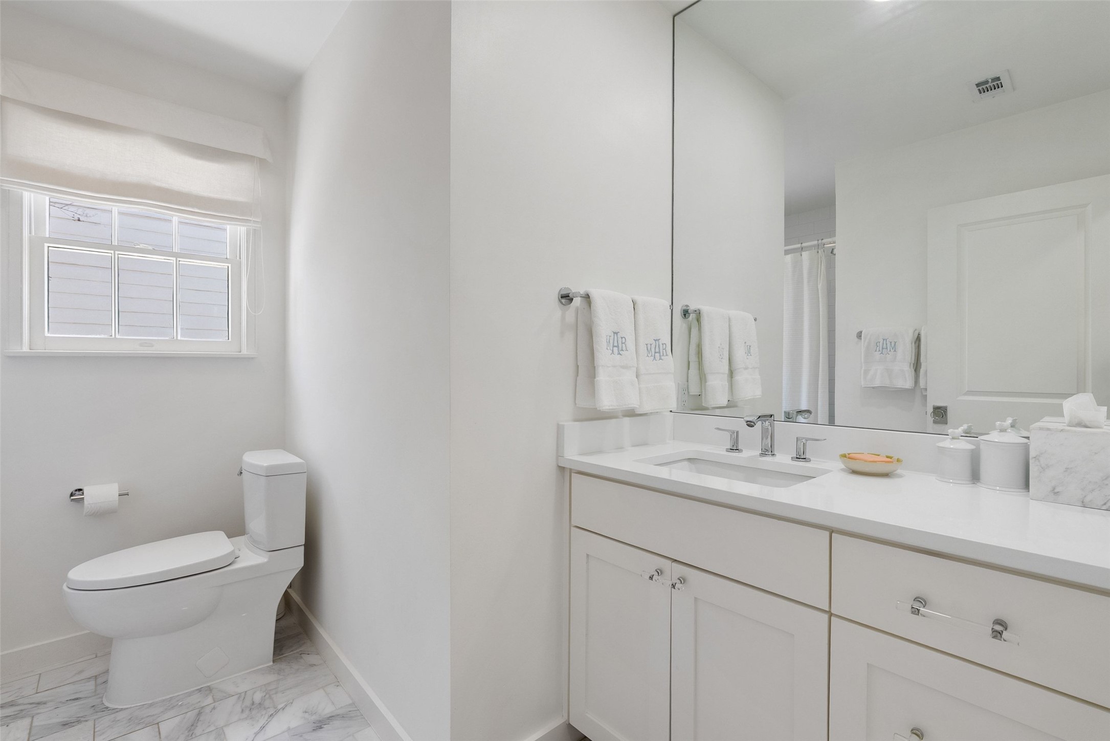 3311 Bonnie Road Austin, TX 78703 - Photo 26 of 40 a bathroom with a toilet sink and mirror