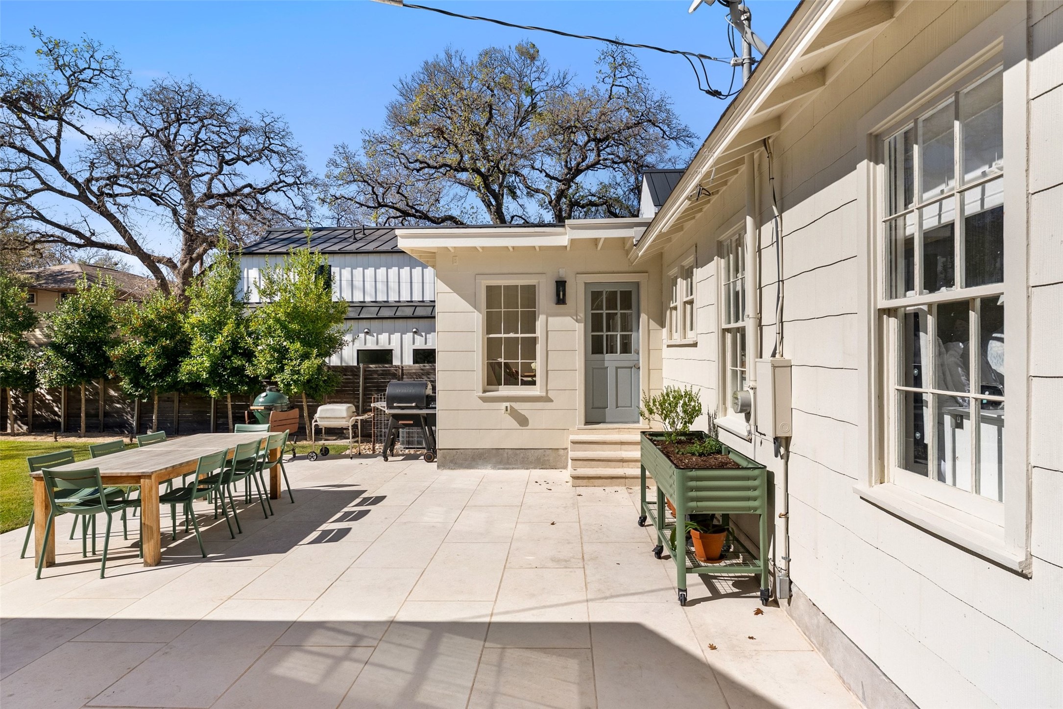 3311 Bonnie Road Austin, TX 78703 - Photo 28 of 40 a view of a patio with table and chairs and wooden floor