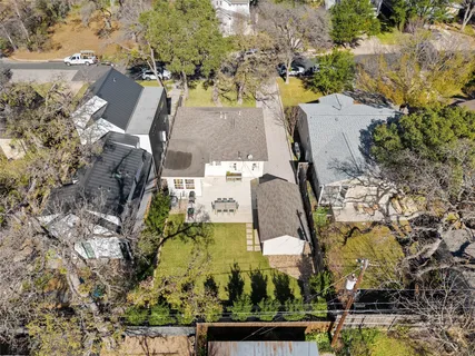 an aerial view of residential houses with outdoor space