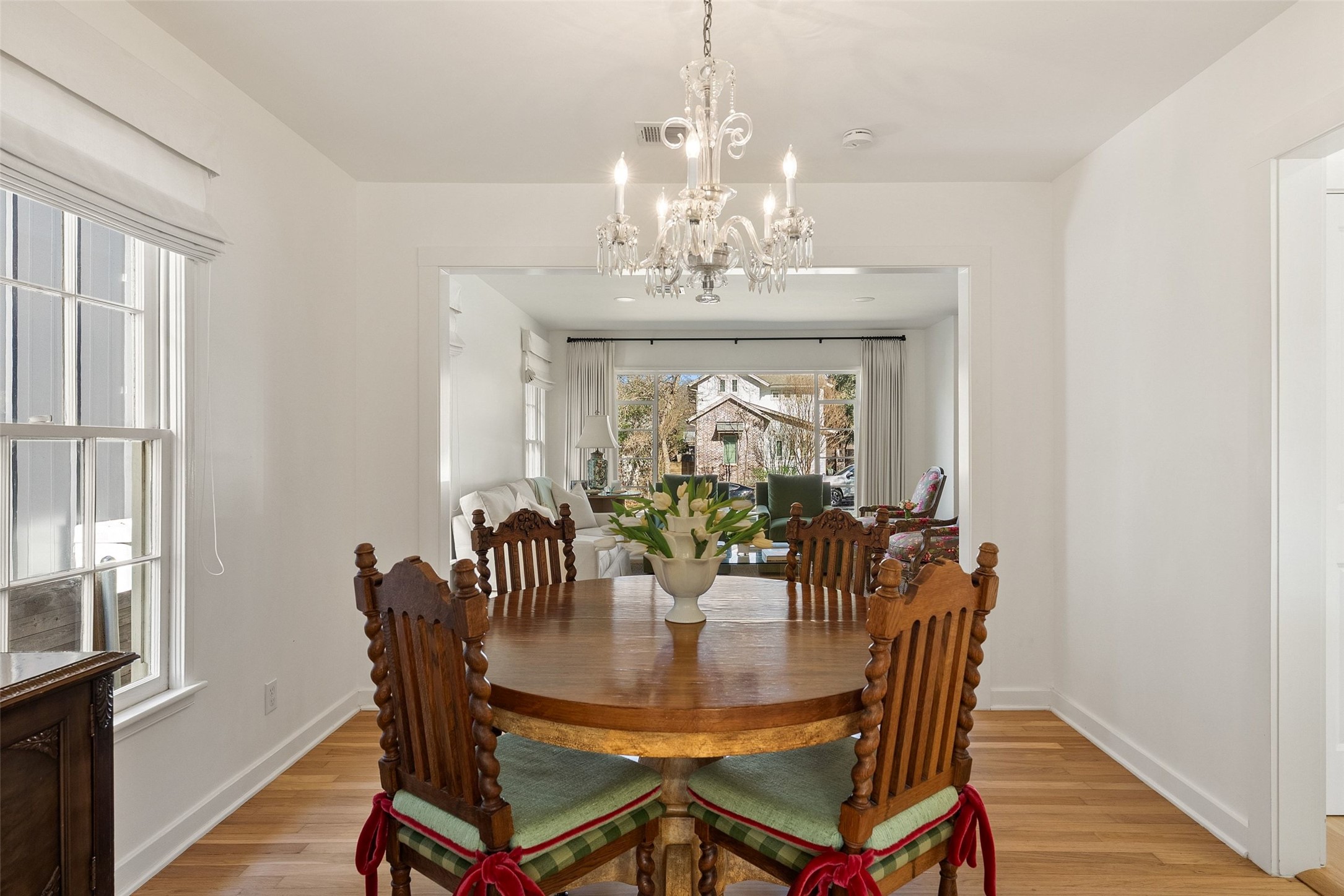 3311 Bonnie Road Austin, TX 78703 - Photo 9 of 40 a view of a dining room with furniture and chandelier