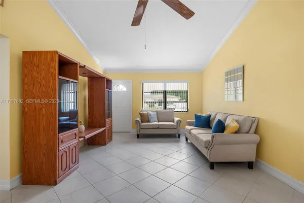 a living room with furniture and a window