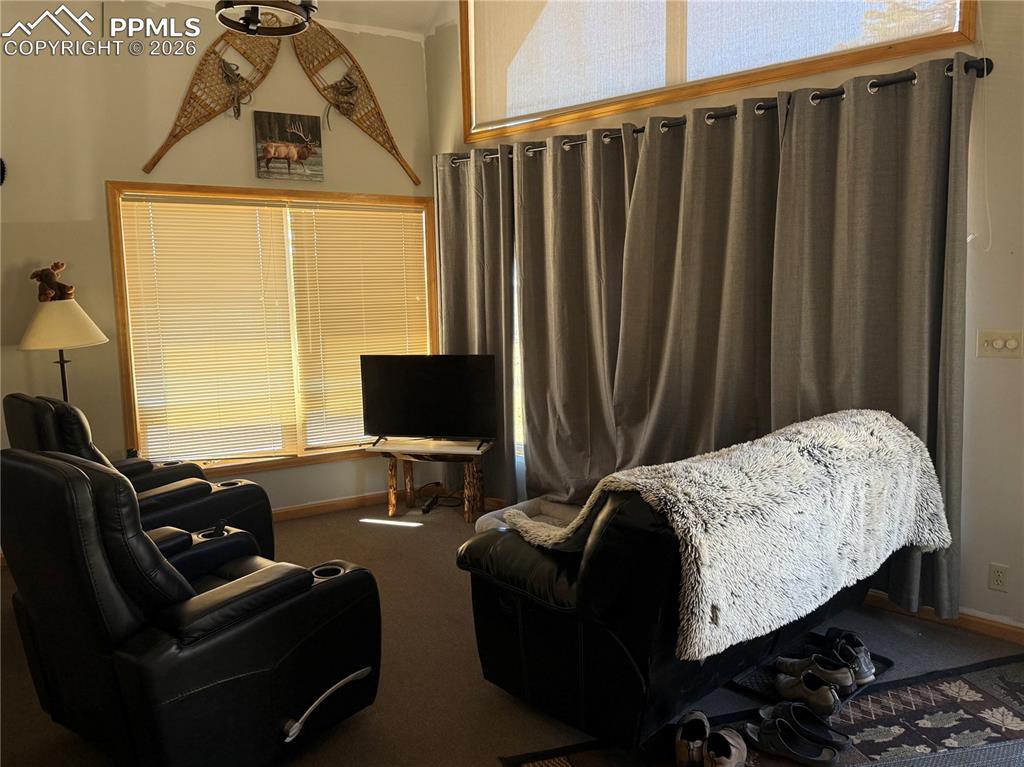 450 Schierl Road Fort Garland, CO 81133 - Photo 21 of 40 a bedroom with bed chair and a window