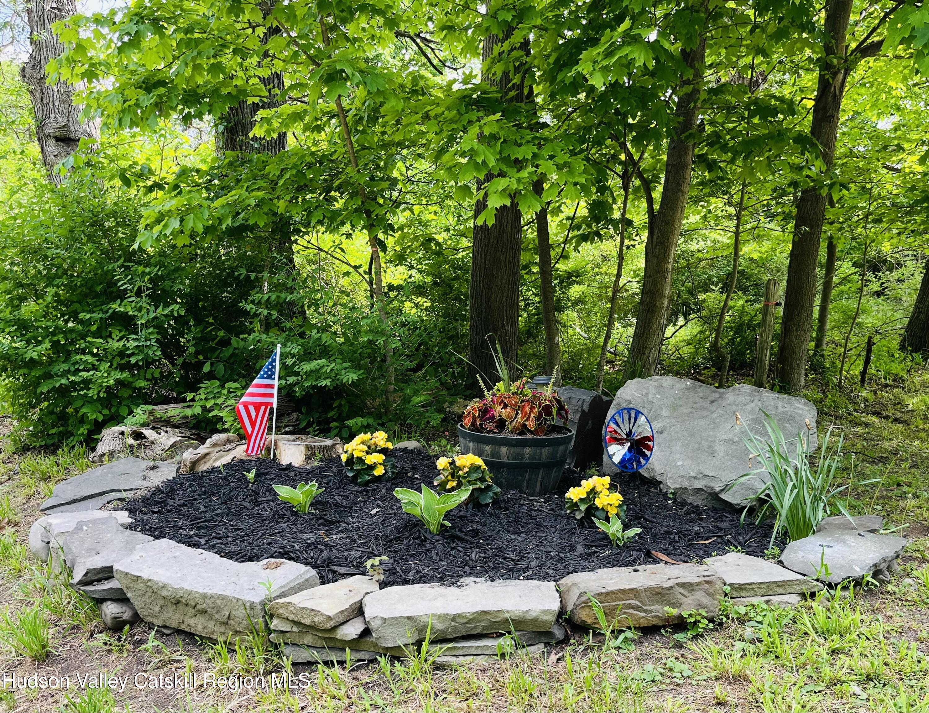 685 Sandy Plains Road Athens, NY 12451 - Photo 25 of 37 a group of people sitting in a yard