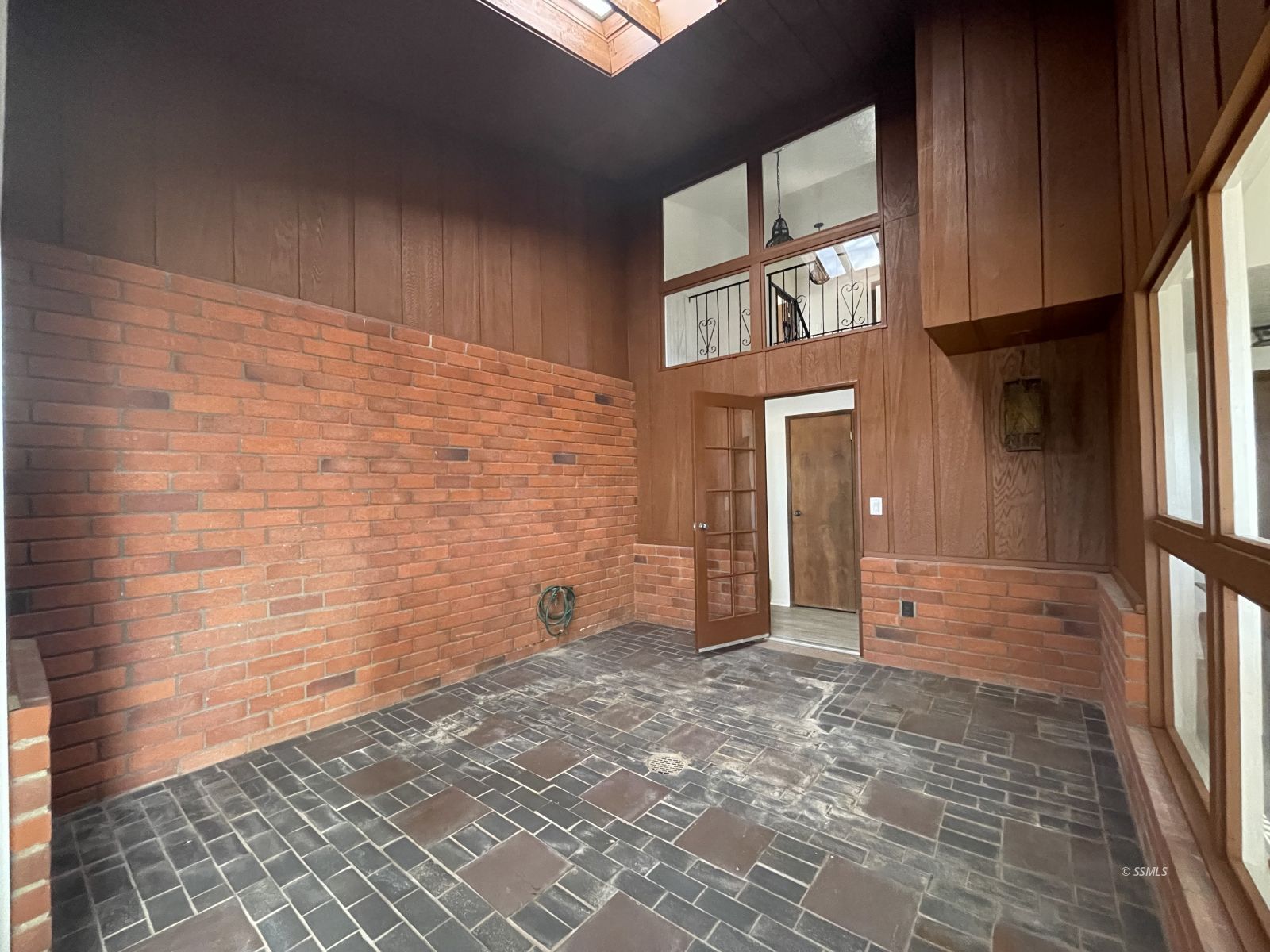 1562 West Reeves Avenue Ridgecrest, CA 93555 - Photo 13 of 45 a view of a brick wall with an empty room