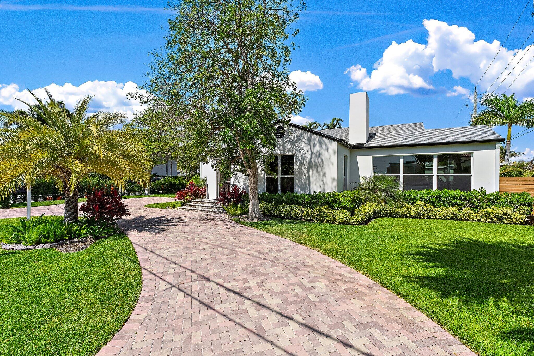 4015 Washington Road West Palm Beach, FL 33405 - Photo 1 of 31 a view of a house with a backyard