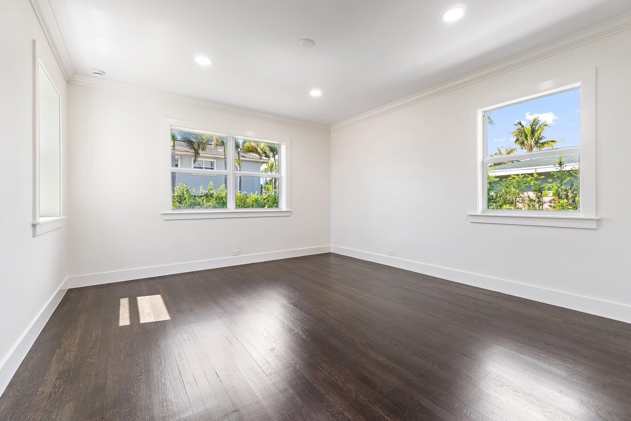 4015 Washington Road West Palm Beach, FL 33405 - Photo 12 of 31 a view of an empty room with wooden floor and a window