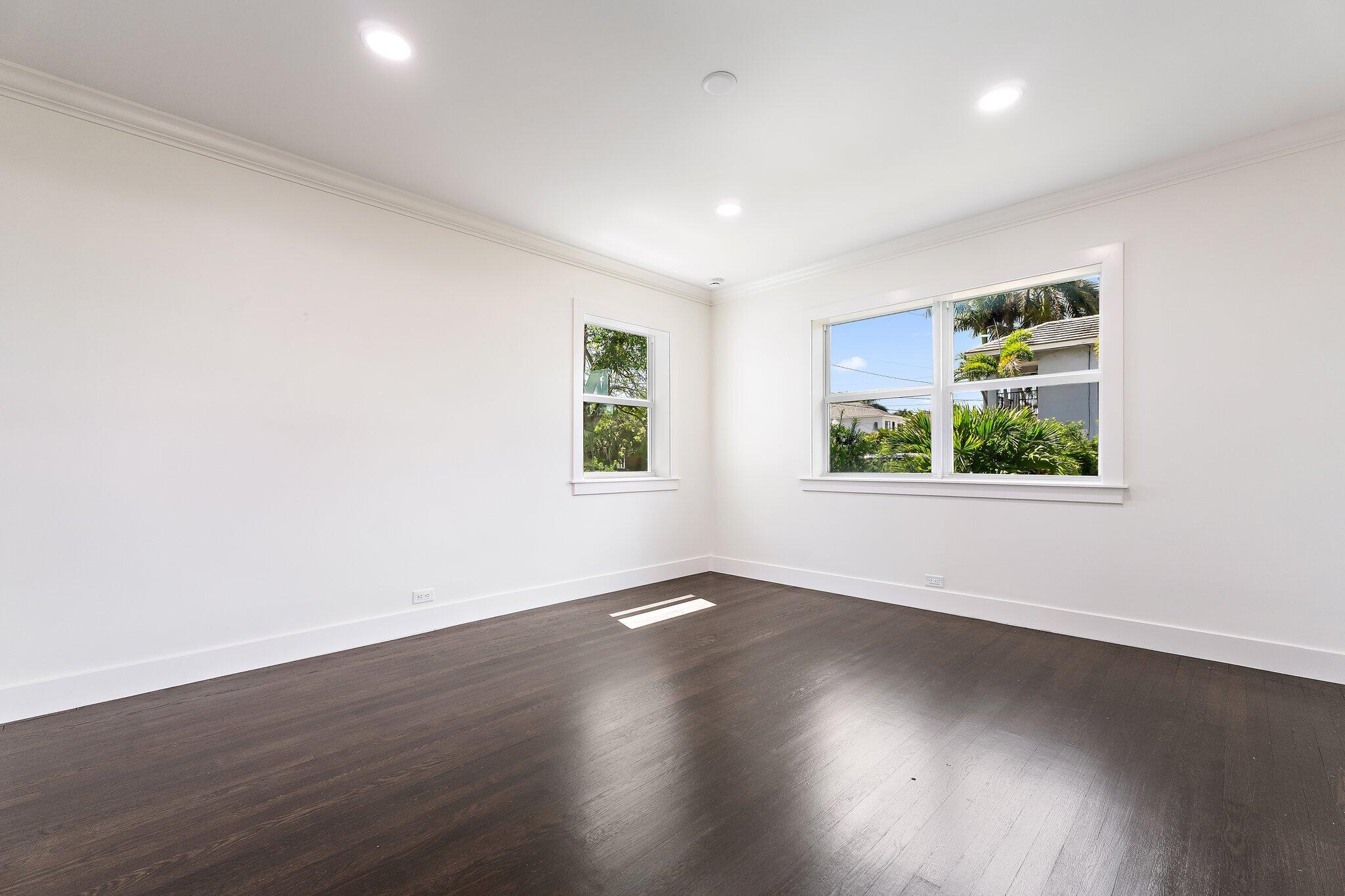 4015 Washington Road West Palm Beach, FL 33405 - Photo 13 of 31 an empty room with wooden floor and window