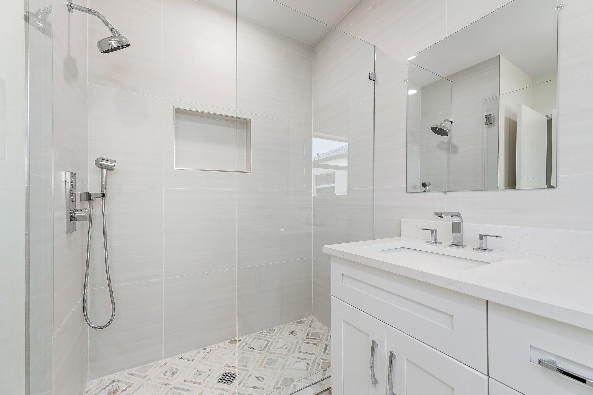 4015 Washington Road West Palm Beach, FL 33405 - Photo 14 of 31 a bathroom with a sink a toilet and shower