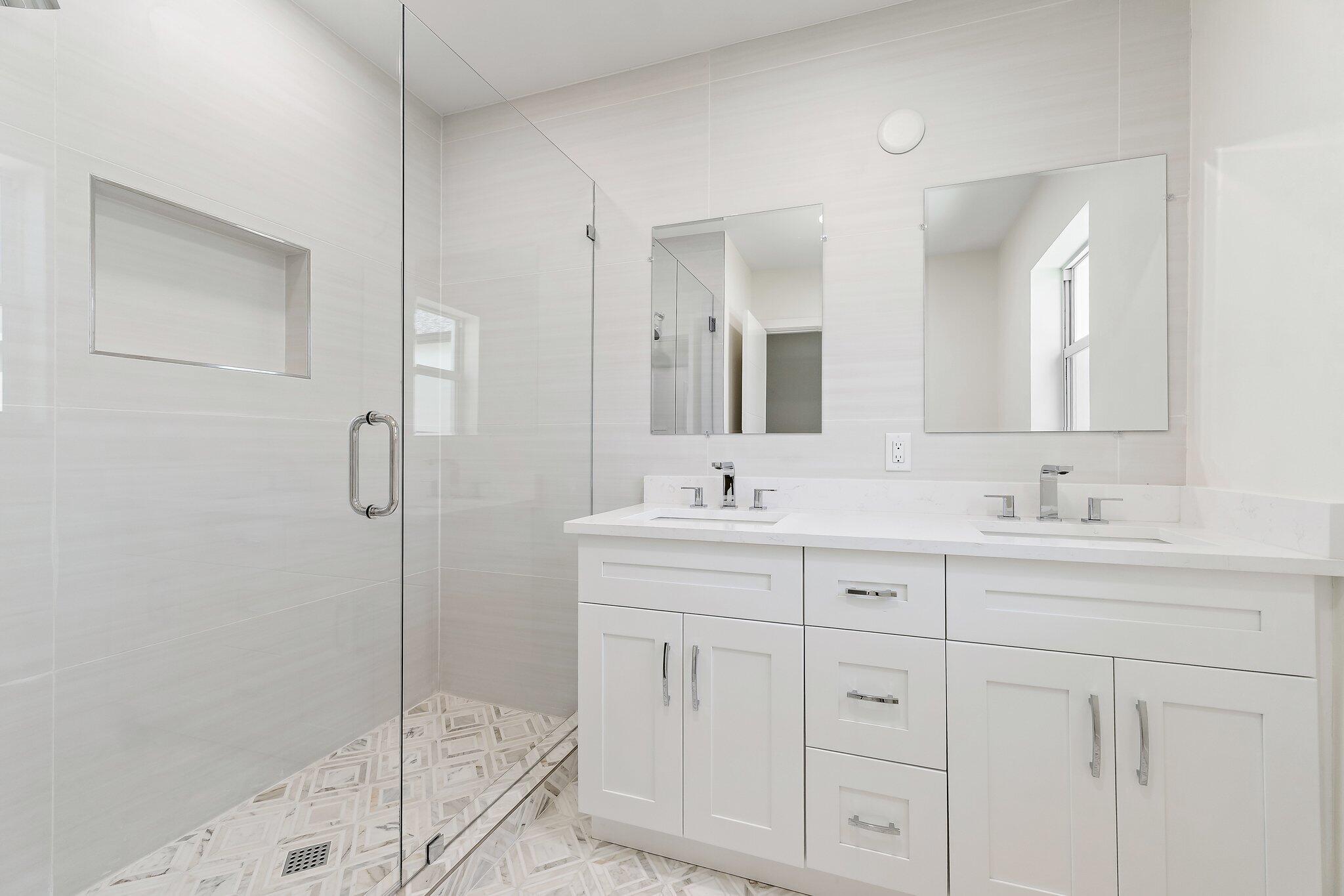 4015 Washington Road West Palm Beach, FL 33405 - Photo 15 of 31 a bathroom with a shower sink and mirror