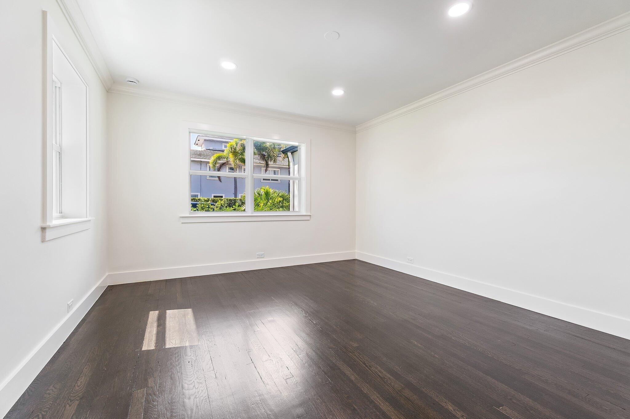4015 Washington Road West Palm Beach, FL 33405 - Photo 16 of 31 an empty room with wooden floor and window