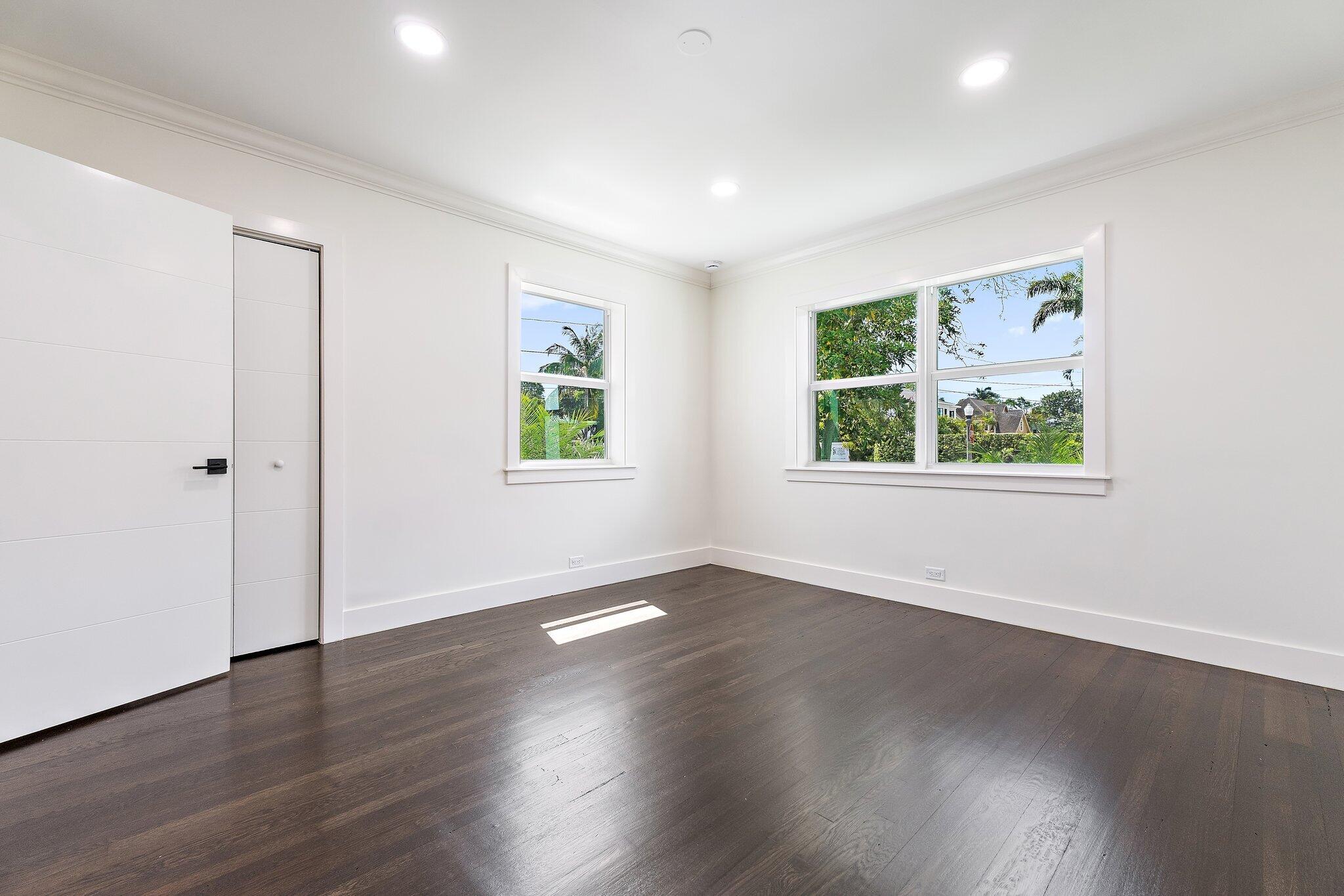 4015 Washington Road West Palm Beach, FL 33405 - Photo 17 of 31 an empty room with wooden floor and windows