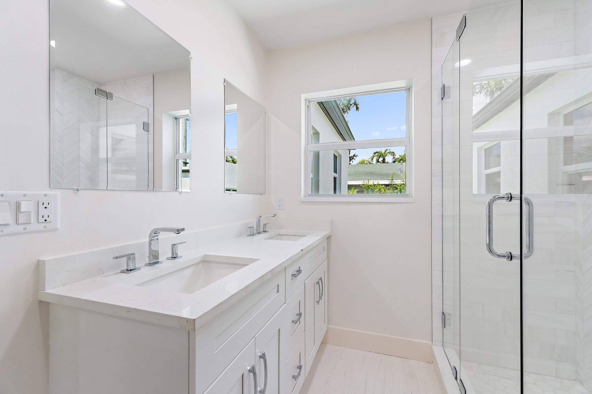 4015 Washington Road West Palm Beach, FL 33405 - Photo 19 of 31 a bathroom with a sink and a mirror