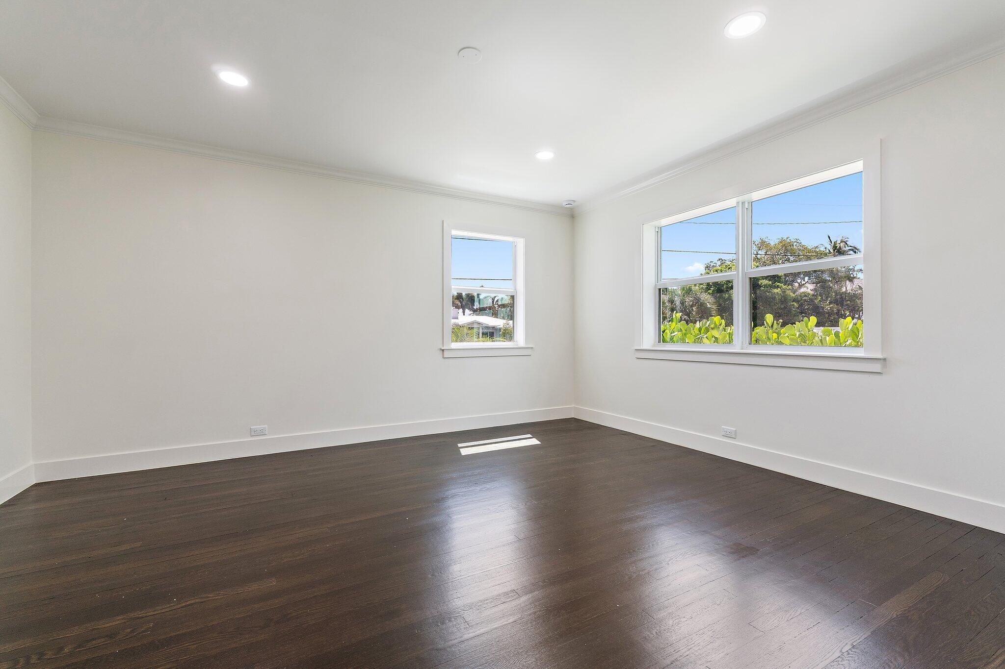 4015 Washington Road West Palm Beach, FL 33405 - Photo 20 of 31 a view of an empty room with wooden floor and a window
