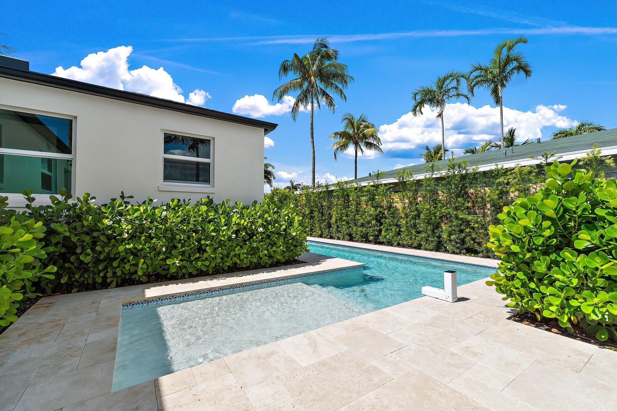 4015 Washington Road West Palm Beach, FL 33405 - Photo 22 of 31 a front view of a house with a yard