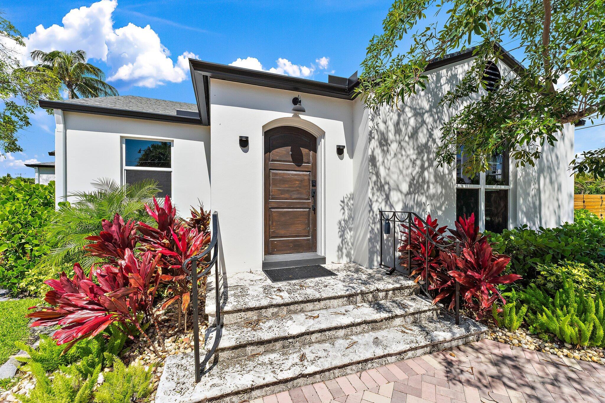 4015 Washington Road West Palm Beach, FL 33405 - Photo 3 of 31 a front view of a house with a yard