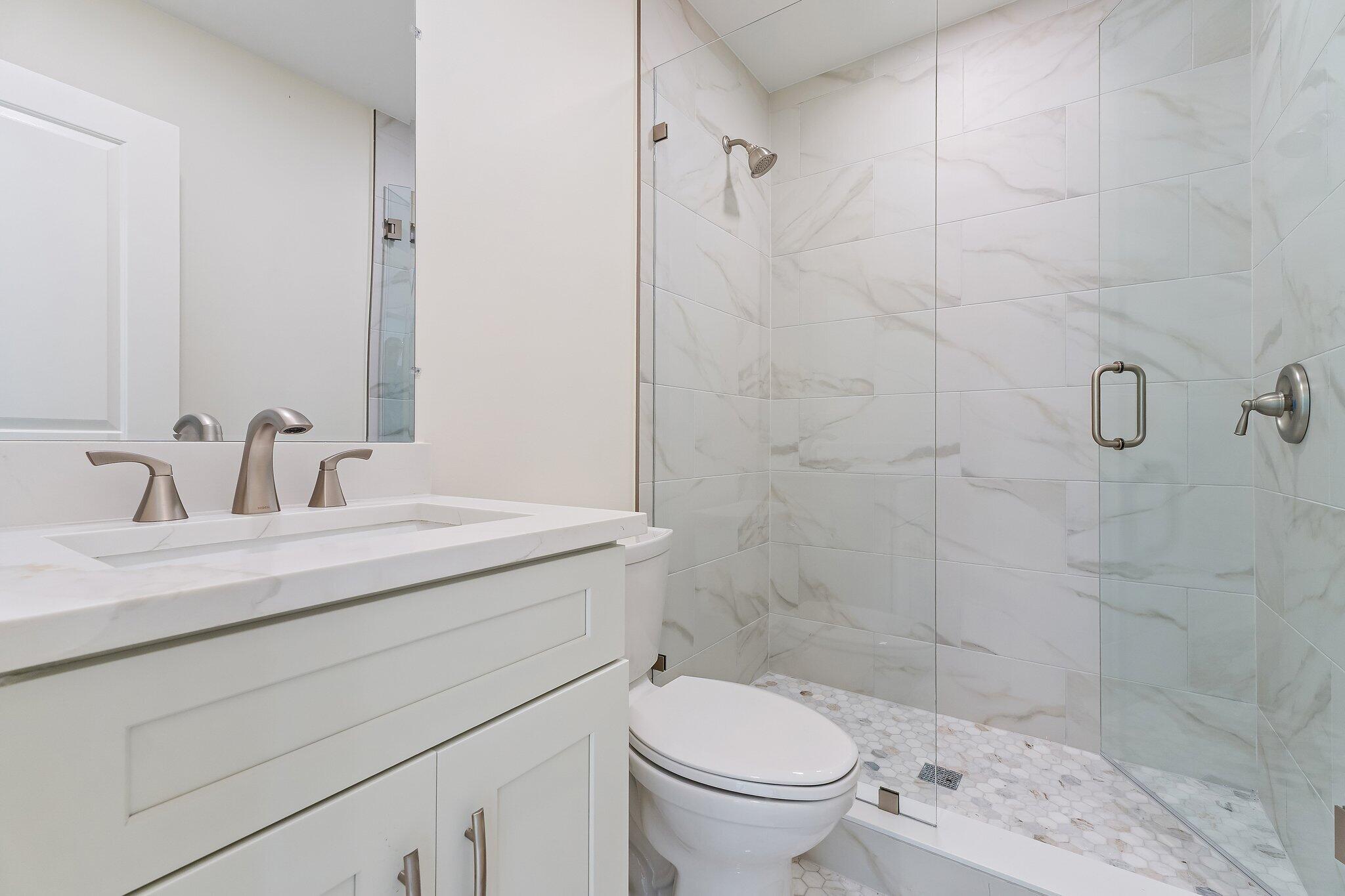 4015 Washington Road West Palm Beach, FL 33405 - Photo 31 of 31 a bathroom with a sink a toilet and shower