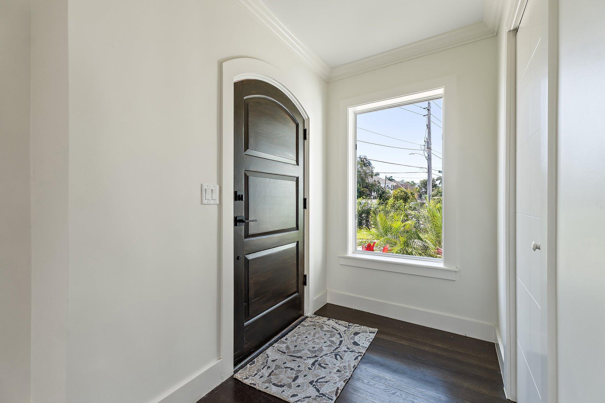 4015 Washington Road West Palm Beach, FL 33405 - Photo 4 of 31 a view of entryway with window and wooden floor