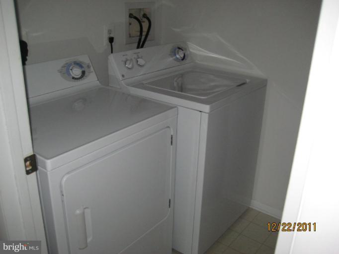 11703 Olde English Drive, Unit 11703A Reston, VA 20190 - Photo 12 of 19 a utility room with dryer and washer