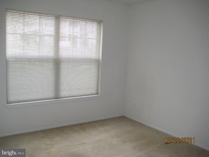 11703 Olde English Drive, Unit 11703A Reston, VA 20190 - Photo 16 of 19 an empty room with a window