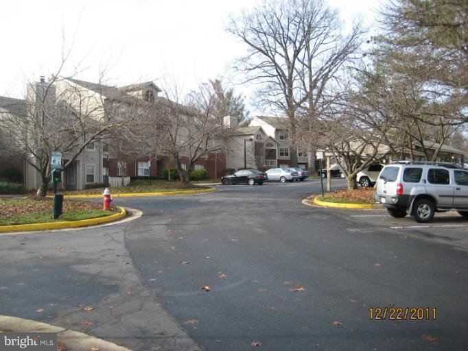 11703 Olde English Drive, Unit 11703A Reston, VA 20190 - Photo 18 of 19 a view of a street with houses