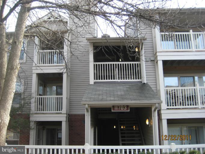 11703 Olde English Drive, Unit 11703A Reston, VA 20190 - Photo 19 of 19 a front view of a house with a door