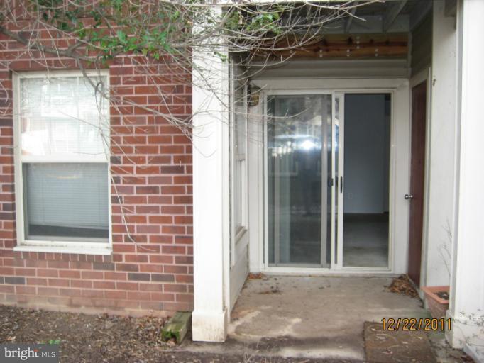 11703 Olde English Drive, Unit 11703A Reston, VA 20190 - Photo 4 of 19 a view of a brick house with front door