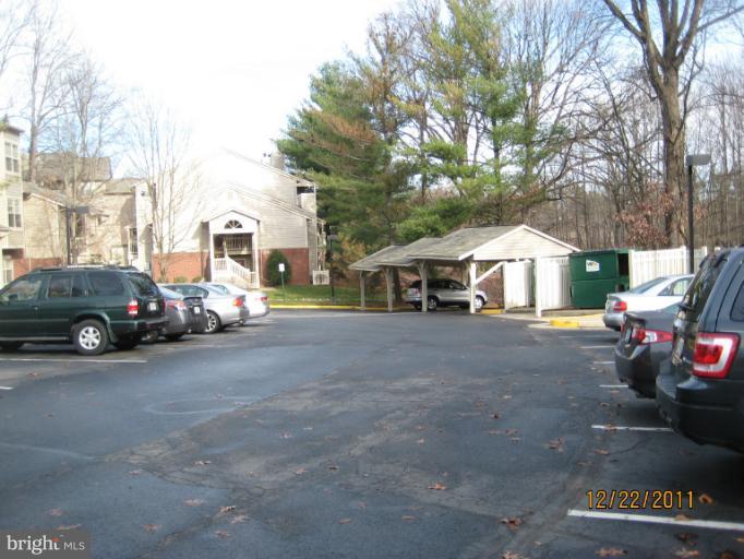 11703 Olde English Drive, Unit 11703A Reston, VA 20190 - Photo 6 of 19 a view of a cars park in front of a building