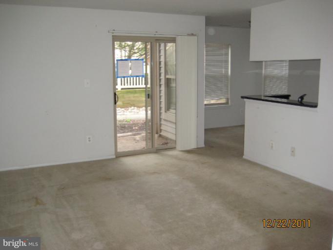 11703 Olde English Drive, Unit 11703A Reston, VA 20190 - Photo 7 of 19 an empty room with windows and closet