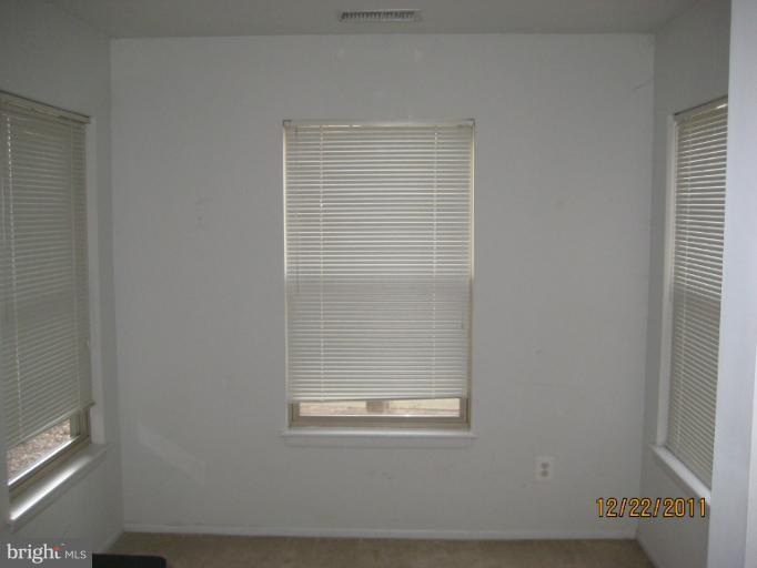 11703 Olde English Drive, Unit 11703A Reston, VA 20190 - Photo 8 of 19 a view of wooden door