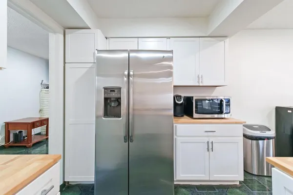a kitchen with stainless steel appliances a refrigerator and a stove