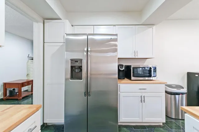 a kitchen with stainless steel appliances a refrigerator and a stove