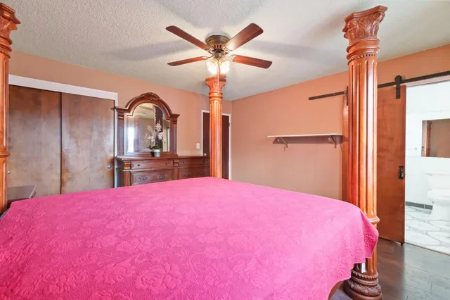 a bed room with a bed and a chandelier