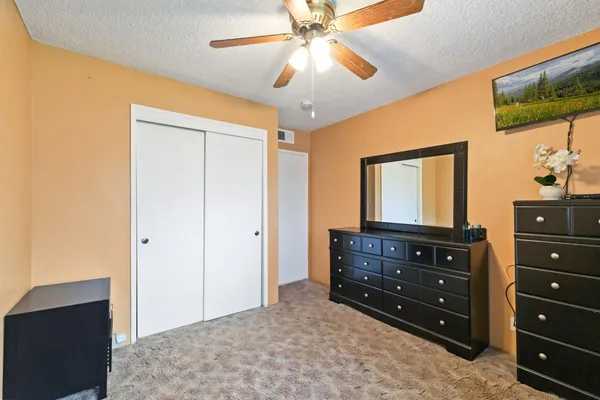 a room with a dresser and a mirror