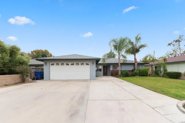 a view of house with outdoor space and yard