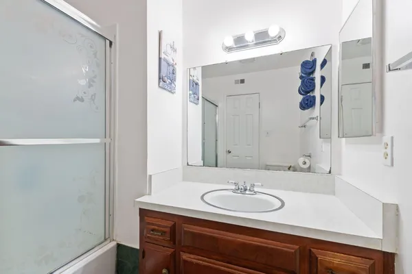 a bathroom with a sink and a mirror