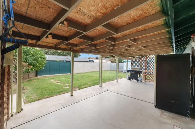 a view of a backyard of a house with a porch
