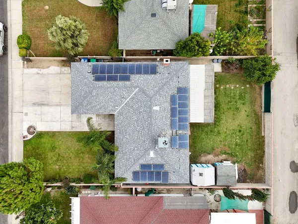 an aerial view of a house with outdoor space
