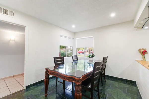 a view of a dining room with furniture