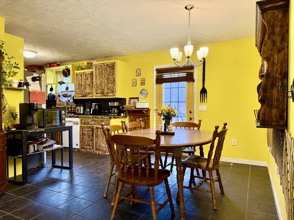 a kitchen with a sink and a stove next to a window